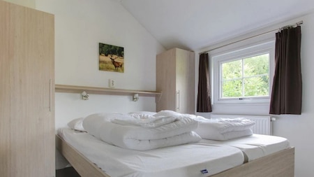 Slaapkamer - EuroParcs Resort Poort de Wije Werelt Slaapkamer - EuroParcs Resort Poort de Wije Werelt