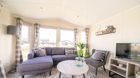 Woonkamer - Vakantiepark Aan de Maas Woonkamer - Vakantiepark Aan de Maas