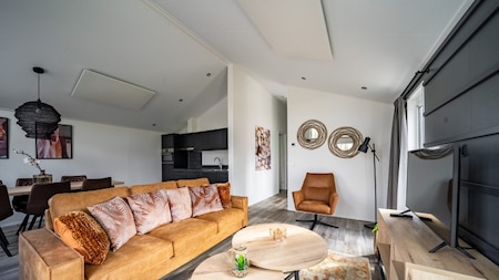 Woonkamer - Vakantiepark Aan de Maas Woonkamer - Vakantiepark Aan de Maas