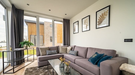 Woonkamer - Vakantiepark Aan de Maas Woonkamer - Vakantiepark Aan de Maas