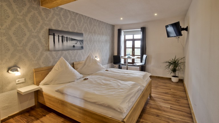 Standaardkamer met havenzicht - Bar - Hotel Restaurant Packhaus