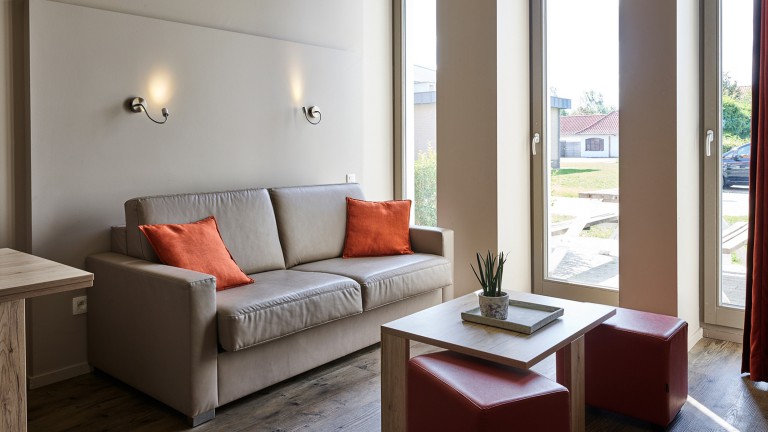 Woonkamer - Holiday Suites Westende