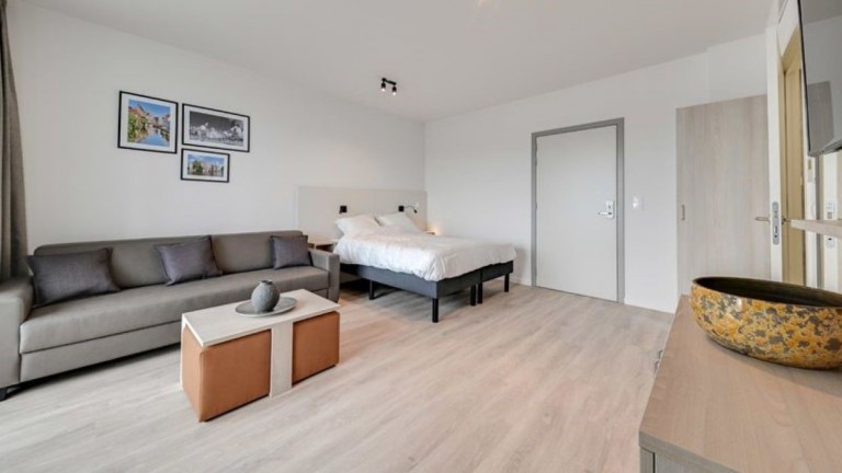 Woonkamer - Holiday Suites Jabbeke