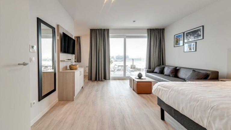 Woonkamer - Holiday Suites Jabbeke