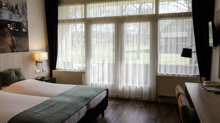 Superior tweepersoonskamer met balkon - Hotel en Restaurant van Saaze