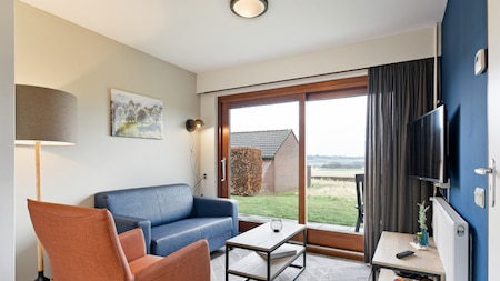 Wohnzimmer - Summio Vakantiepark Reevallis