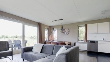 Wohnzimmer und Küche - RCN Vakantiepark de Potten
