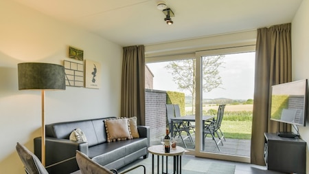 Wohnzimmer - Summio Vakantiepark Reevallis