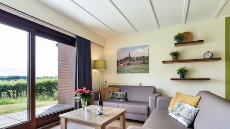 Wohnzimmer - Summio Vakantiepark Reevallis
