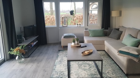 Woonkamer - Vakantiepark de Luttenberg Woonkamer - Vakantiepark de Luttenberg