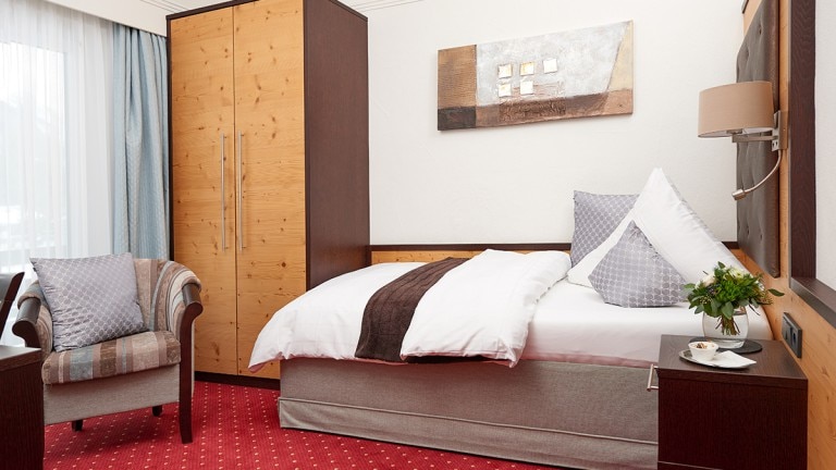 Eenpersoonskamer met oostelijk/westelijk balkon