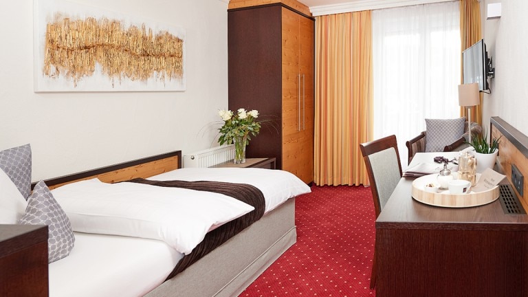 Eenpersoonskamer met oostelijk/westelijk balkon