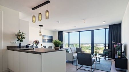 Wohnzimmer und Küche - Dormio Breskens Apartments en Penthouses