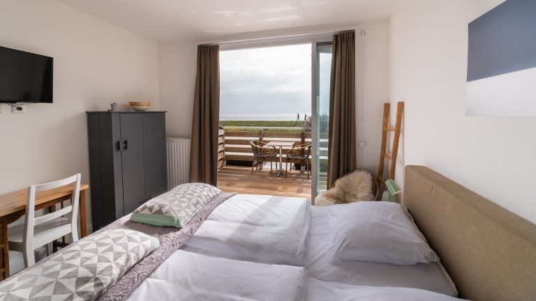 Zimmer mit Meerblick und Balkon