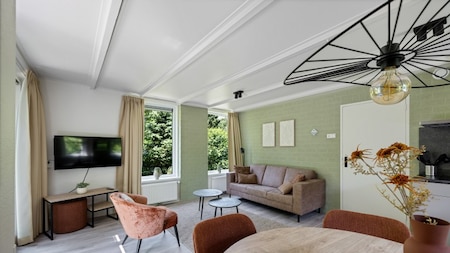 Woonkamer - RCN Vakantiepark De Roggeberg Woonkamer - RCN Vakantiepark De Roggeberg