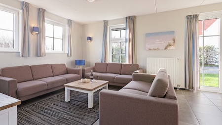 Woonkamer - Dormio Strand Resort Nieuwvliet-Bad