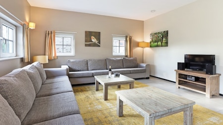 Woonkamer - Dormio Strand Resort Nieuwvliet-Bad