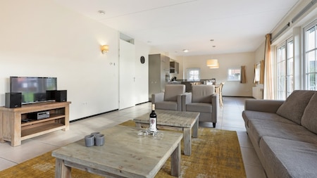 Woonkamer - Dormio Strand Resort Nieuwvliet-Bad