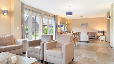 Woonkamer - Dormio Strand Resort Nieuwvliet-Bad