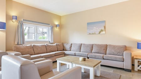 Woonkamer - Dormio Strand Resort Nieuwvliet-Bad