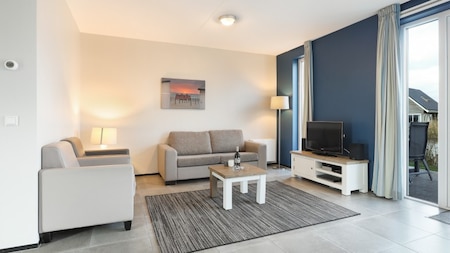 Woonkamer - Dormio Strand Resort Nieuwvliet-Bad