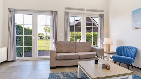 Woonkamer - Dormio Strand Resort Nieuwvliet-Bad