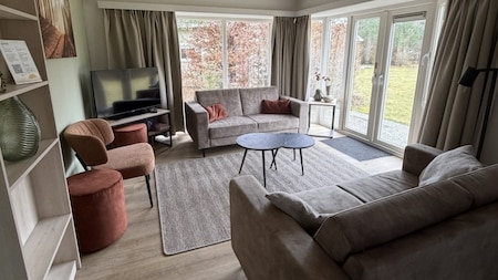 Woonkamer - RCN Vakantiepark  De Roggeberg