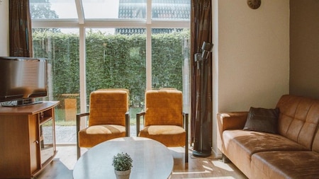 Woonkamer - Vakantiepark Sallandshoeve Woonkamer - Vakantiepark Sallandshoeve