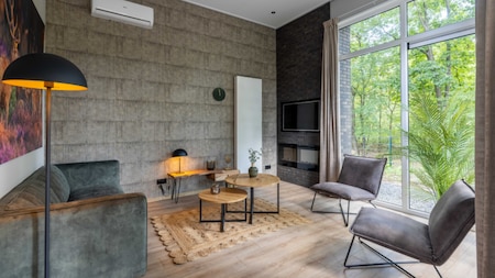 Woonkamer - Vakantiepark De Rimboe en De Woeste Hoogte
