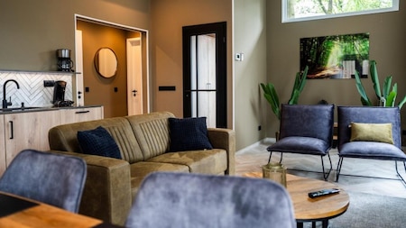 Woonkamer - Vakantiepark De Rimboe en De Woeste Hoogte