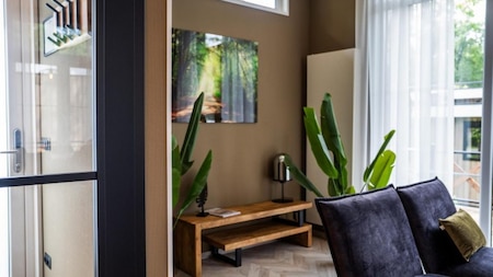 Woonkamer - Vakantiepark De Rimboe en De Woeste Hoogte