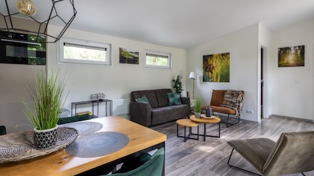 Woonkamer - Vakantiepark De Rimboe en De Woeste Hoogte