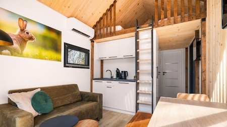 Woonkamer - Vakantiehoeve Si-Es-An Woonkamer - Vakantiehoeve Si-Es-An