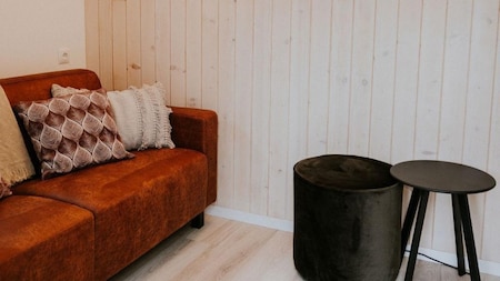 Woonkamer - Vakantiehoeve Si-Es-An Woonkamer - Vakantiehoeve Si-Es-An